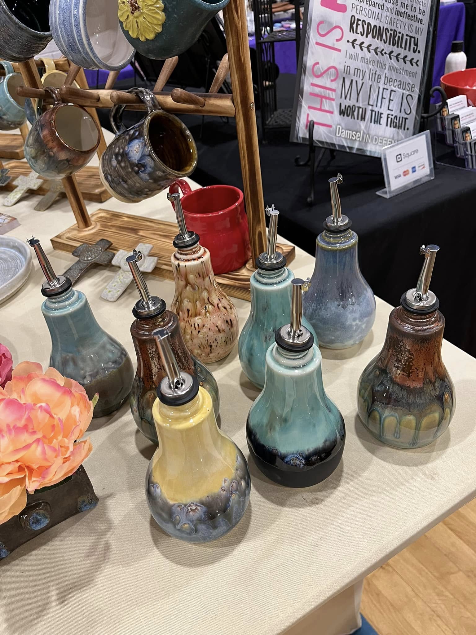 Colorful ceramic oil pourers in varied glazes